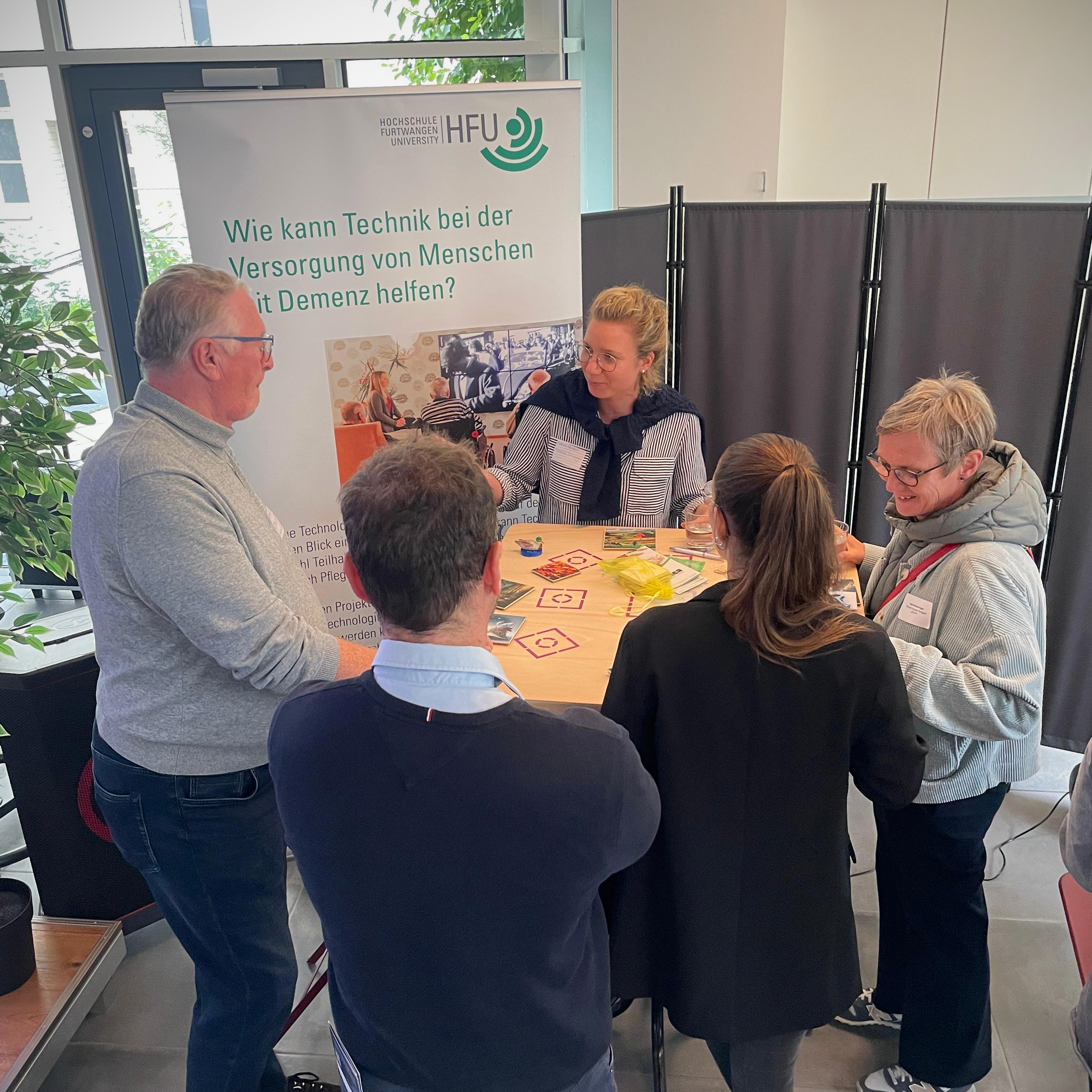 People looking at the Kokea board