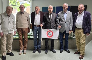 Group of graduates in their old university