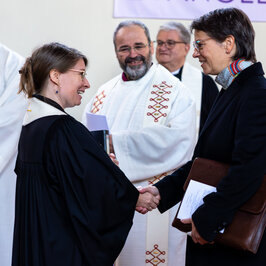 President with the priest before the church service