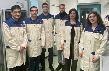 Group photo with project logos