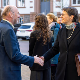 Dr Bormann greeting a guest