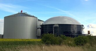 You can see a biogas plant, it consists of two round buildings