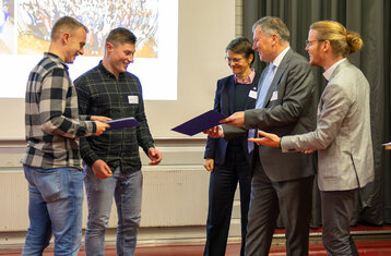 Sven Liehner and Marcel Reichle receiving the prize from Sick Foundation