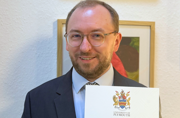 Dr Stodt with his doctoral certificate