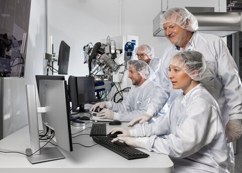 Several scientists working in a lab