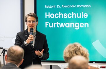 President Bormann speaking at the event