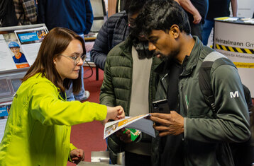 A student getting information at a stand