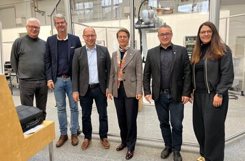 Dr. Alexandra Bormann with several professors and town officials